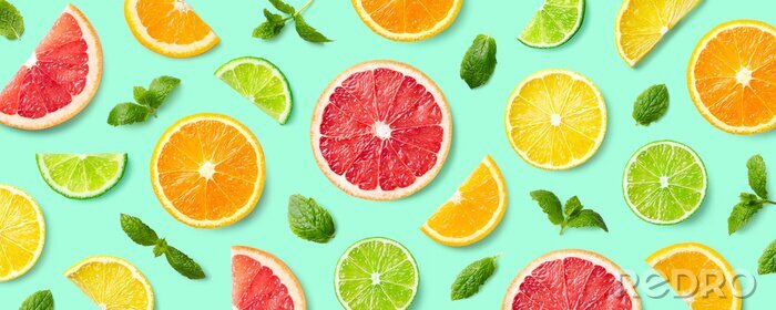 Behang Colorful pattern of citrus fruit slices and mint leaves