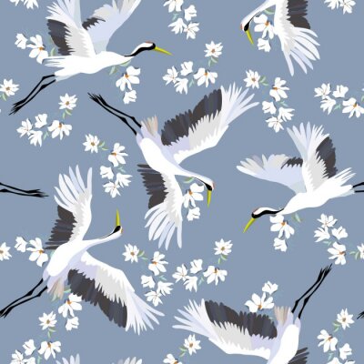 Kraanvogels en witte bloemen op een blauwe achtergrond