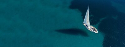 Canvas Aerial drone ultra wide photo of beautiful sail boat sailing in tropical exotic bay with emerald clear sea
