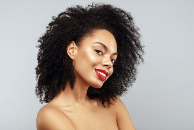 Canvas African American Fashion Model portrait. Brunette curly haired young woman. Beauty salon and haircare concept.