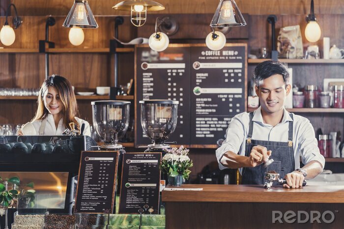 Canvas Asian Barista preparing cup of coffee, espresso with latte or cappuccino for customer order in coffee shop,bartender pouring milk,Small business owner and startup in coffee shop and restaurant concept