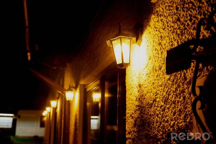 Canvas Beautiful street lanterns illuminated at evening or night