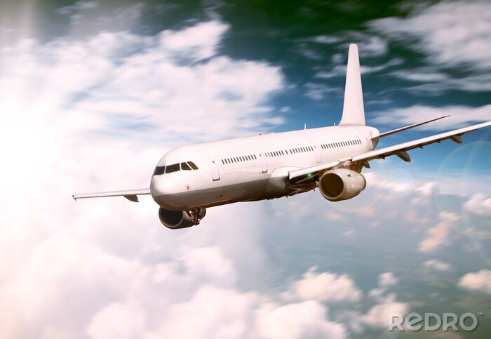 Canvas Big jet vliegtuig vliegt boven wolken