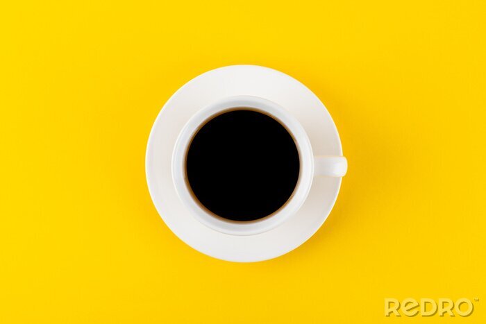 Canvas Black coffee in a cup on a yellow background