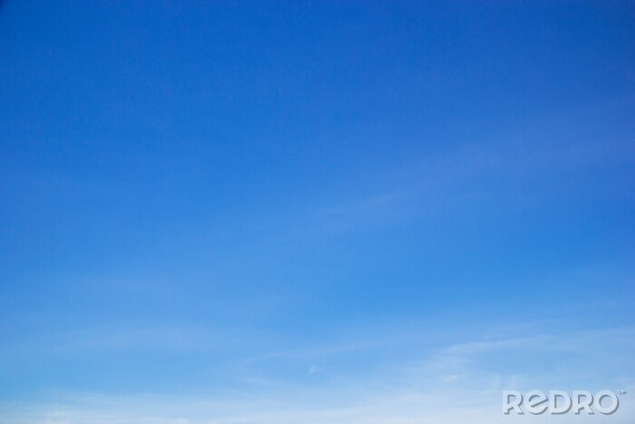 Canvas Blue sky background and white clouds soft focus, and copy space