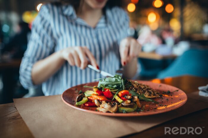Canvas close up of woman in restaurant eating