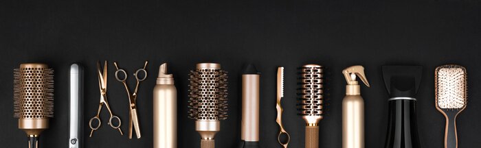 Canvas Collection of professional hair dresser tools arranged on dark background