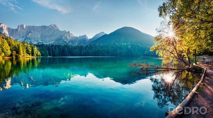 Canvas Colorful summer view of Fusine lake. Bright morning scene of Julian Alps with Mangart peak on background, Province of Udine, Italy, Europe. Traveling concept background.