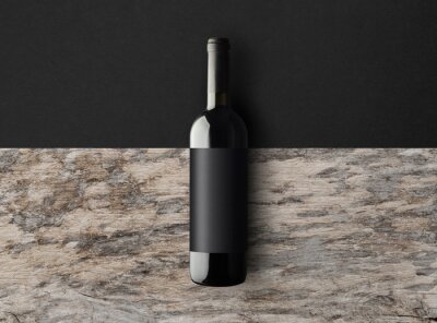 Canvas Dark wine bottle on a black and wooden background with copy space. Wine bottle mockup. Top view. 3d illustration.