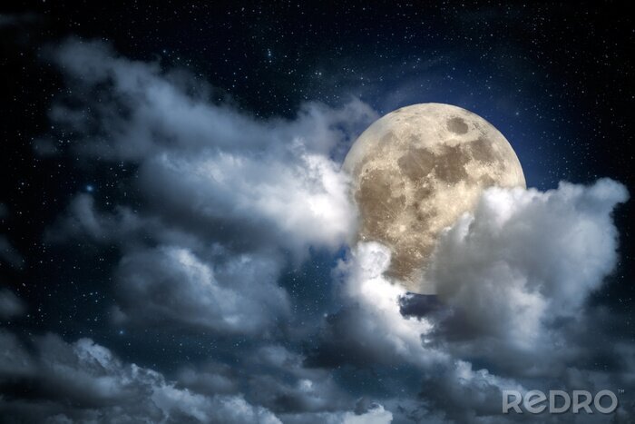 Canvas De maan die vanachter donzige wolken tevoorschijn komt