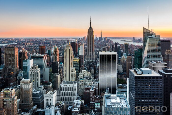 Canvas De skyline van New York City bij zonsondergang