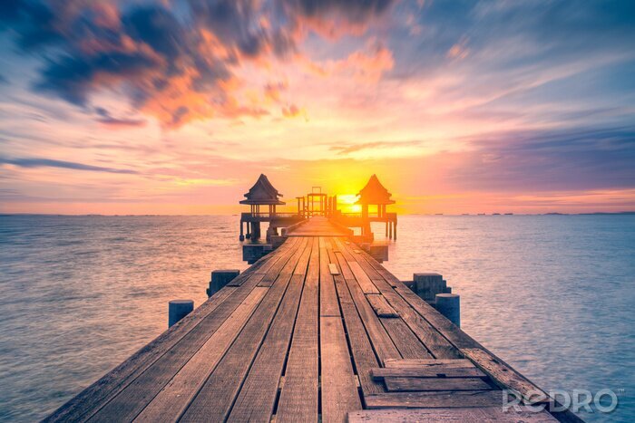 Canvas Een houten pier in de avondzon