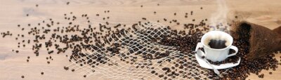 Canvas Een kopje hete koffie en verspreide bonen