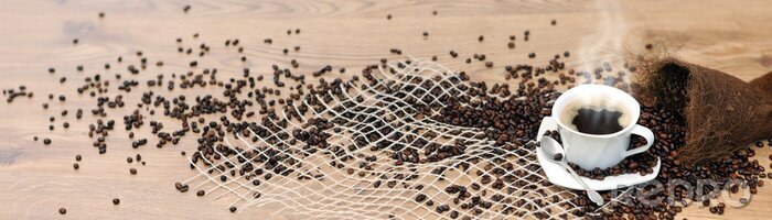 Canvas Een kopje hete koffie en verspreide bonen