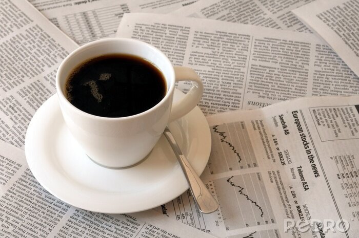 Canvas Een kopje koffie op de kranten
