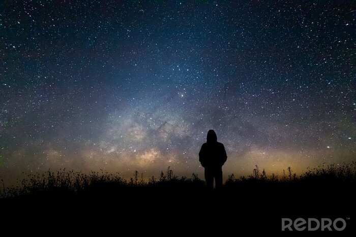 Canvas Een man die naar de sterren kijkt