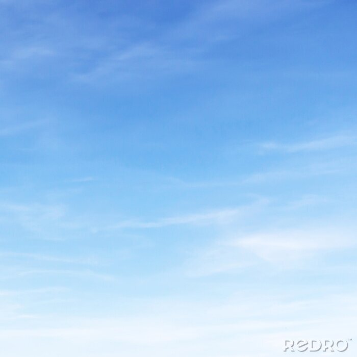 Canvas Fantastische zachte witte wolken tegen de blauwe hemel.