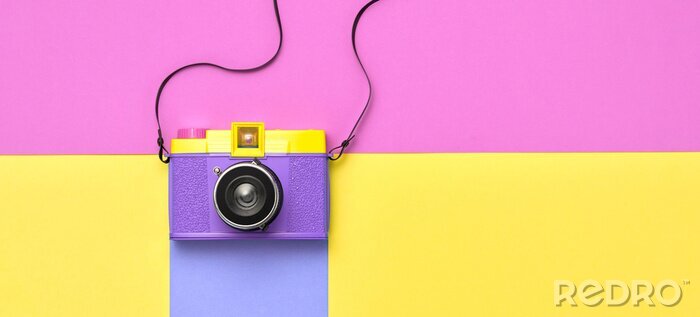 Canvas Fashion film camera. Minimal hipster summer trend flat lay. Retro design camera on vivid color. Summertime concept. Trendy fashionable film camera, creative pop art