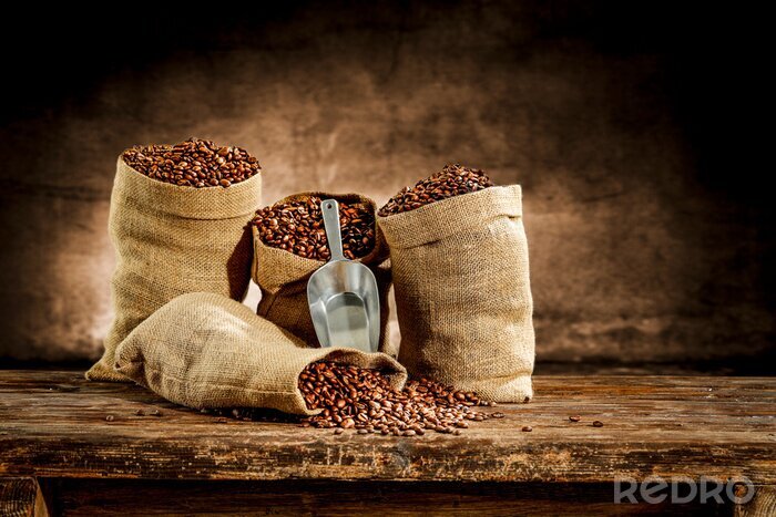 Canvas Fresh old sack of coffee grains and brown old wall background 