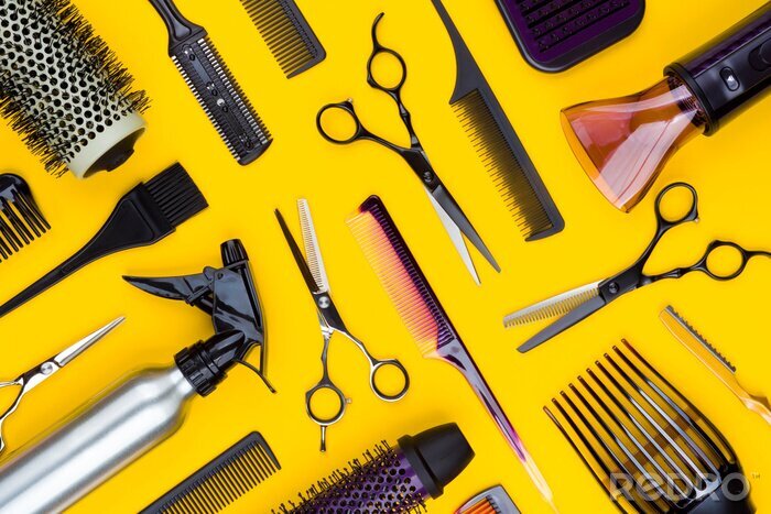Canvas Hairdresser tools and combs tools on yellow background, top view