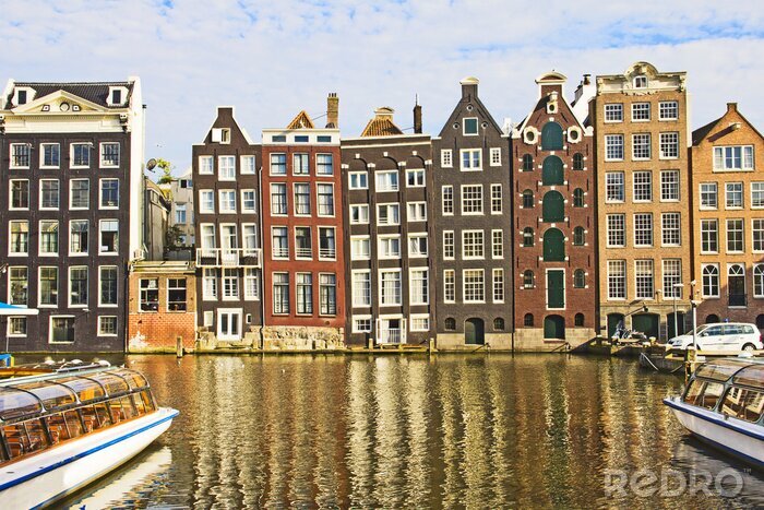 Canvas Huizen in de stad en kanaal in Amsterdam