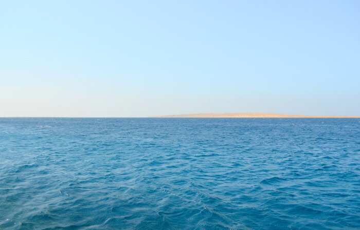 Canvas Kalme zee en blauwe lucht