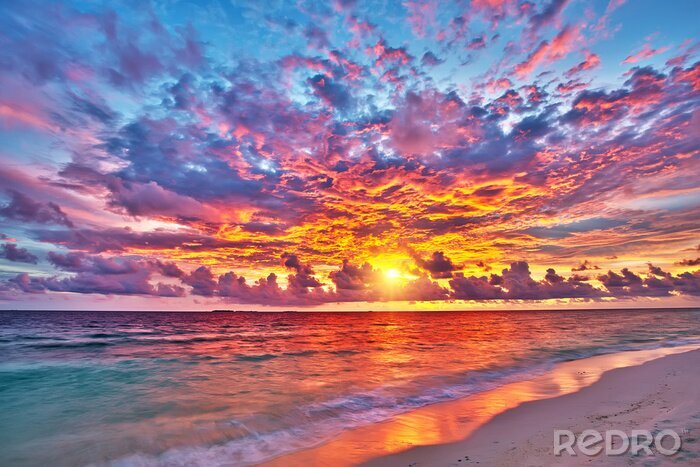 Canvas Kleurrijke zonsondergang over de oceaan op de Malediven