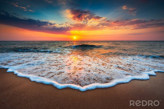 Canvas Kleurrijke zonsopgang bij de zee