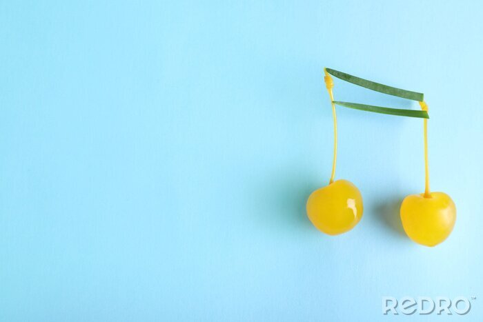 Canvas Musical note made of onion and cocktail cherries on color background, top view. Space for text