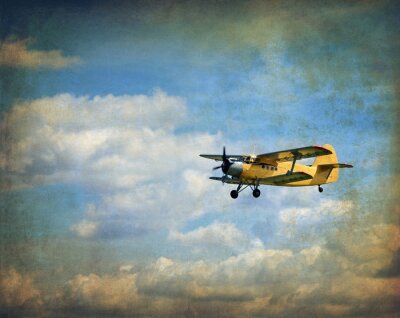 Canvas Oud vliegende tweedekker, retro luchtvaart achtergrond