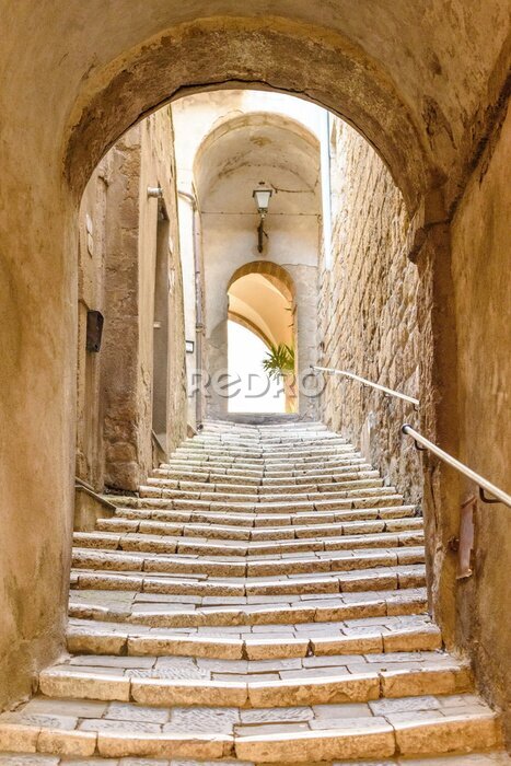 Canvas oude stenen trap en boog in het middeleeuwse dorp, Pitigliano, Toscane, Italië
