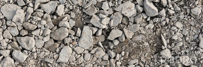 Canvas Panoramic image. Gray gravel stones for the underground in road construction