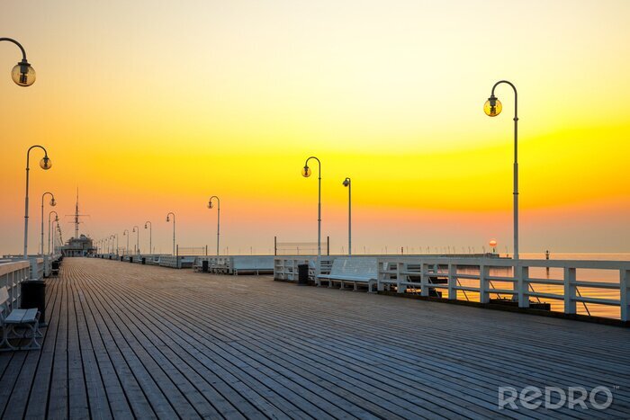 Canvas Pier op de achtergrond van de ondergaande zon