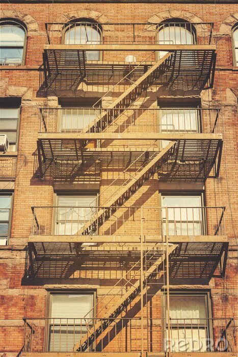 Canvas Retro-stijl foto van het gebouw met brandtrap ladders, NYC.