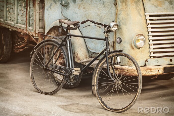 Canvas Retro styled image of an ancient bike and truck