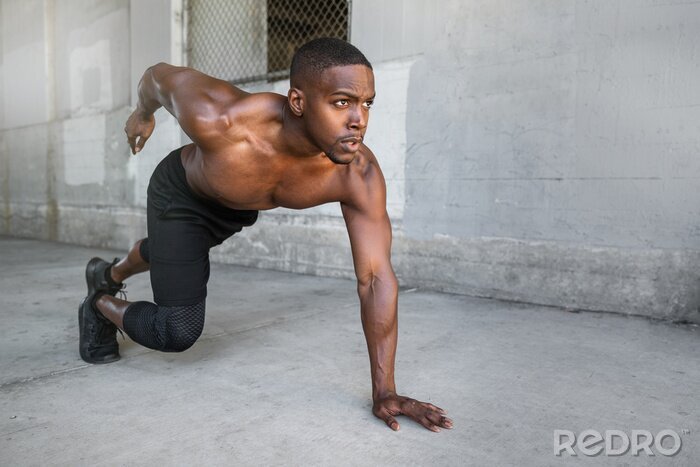 Canvas Shirtless male african american athlete training in urban city concrete background, sprinter, runner, jogger, muscular toned build training for race