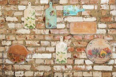 Canvas Snijplanken op een bakstenen muur