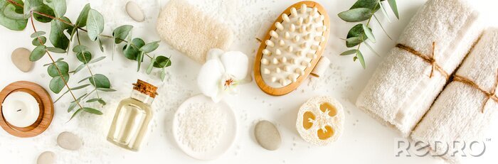 Canvas Spa concept with eucalyptus oil and eucalyptus leaf extract natural /organic spa cosmetics products, eco friendly bathroom accessories. Skincare concept on white background. Flat lay composition 