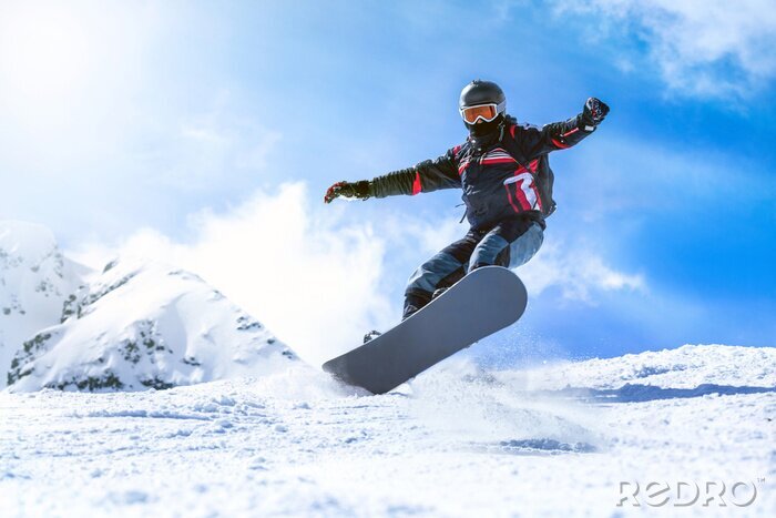 Canvas Springen snowboarder uit heuvel in de winter