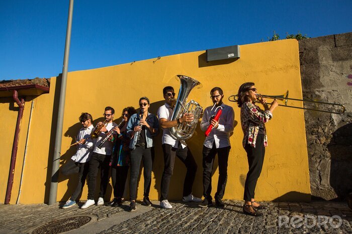 Canvas Streets musicians play music in the street of old downtown, Portugal.