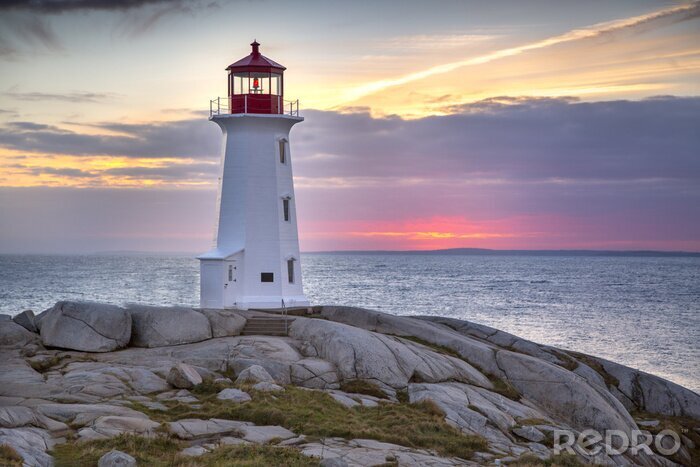 Canvas Sunset behind the lighthouse at Peggy's Cove near Halifax, Nova Scotia Canada.