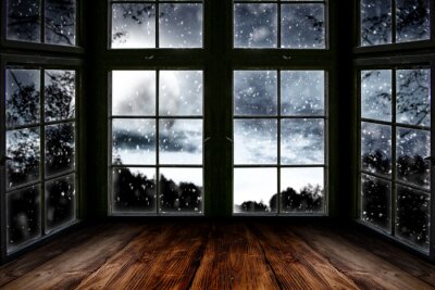 Canvas Table top board with big window background and beautiful snowy winter landscape outside. Moonlight winter night.