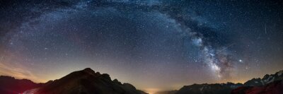Canvas The Milky Way arch starry sky on the Alps, Massif des Ecrins, Briancon Serre Chevalier ski resort, France. Panoramic view high mountain range and glaciers, astro photography, stargazing