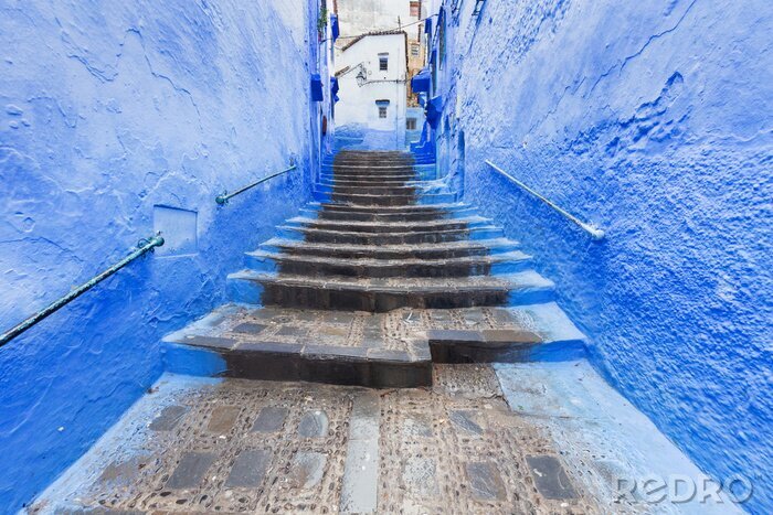 Canvas Traditional typical moroccan architectural details in Chefchaouen, Morocco, Africa Beautiful street of blue medina with blue walls and decorated with various objects (pots, jugs). A city with narrow, 