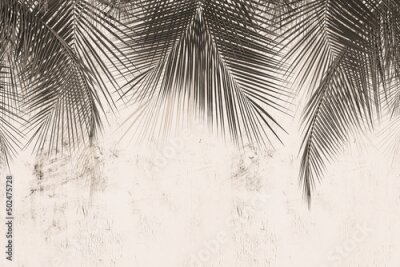 Tropische bladeren op een monochroom betonpatroon