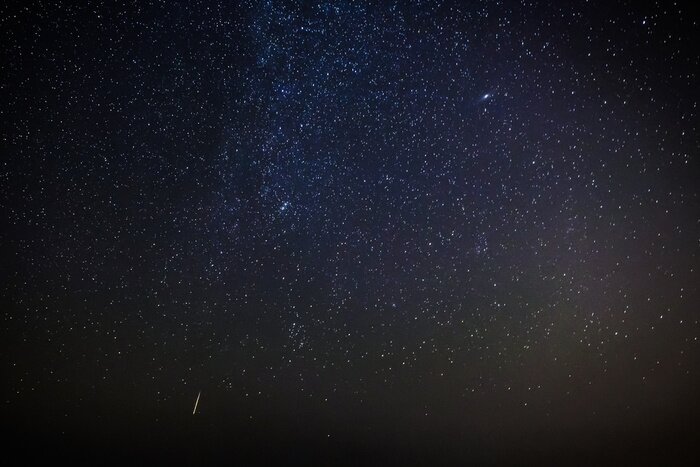 Canvas Vallende ster op de achtergrond van de kosmos