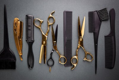 Various hair dresser and cut tools on black background with copy space