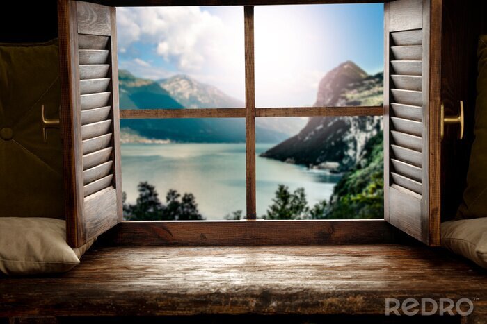 Canvas Wooden window sill background with pillows and free space for your decoration.Landscape of spring lake with mountains nad copy space 