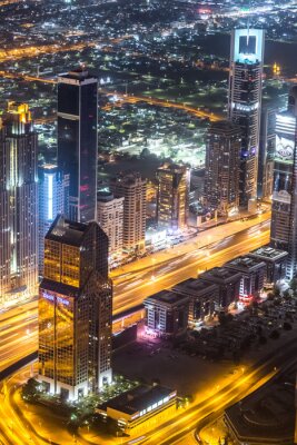 Canvas Dubai centrum nacht scÃ¨ne met stadslichten,
