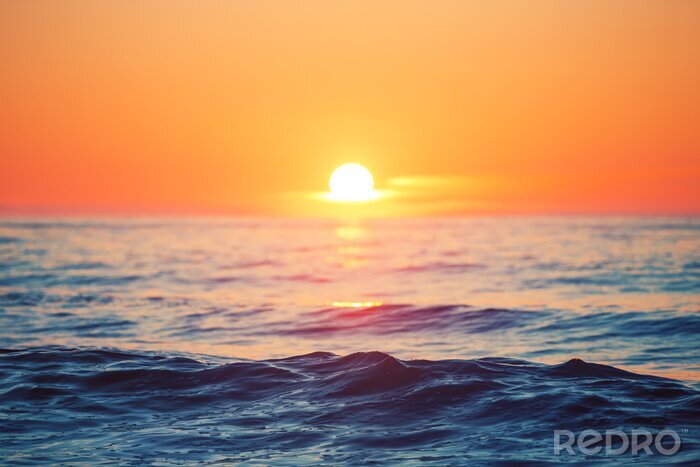 Canvas Zonsondergang over de oceaan en golven